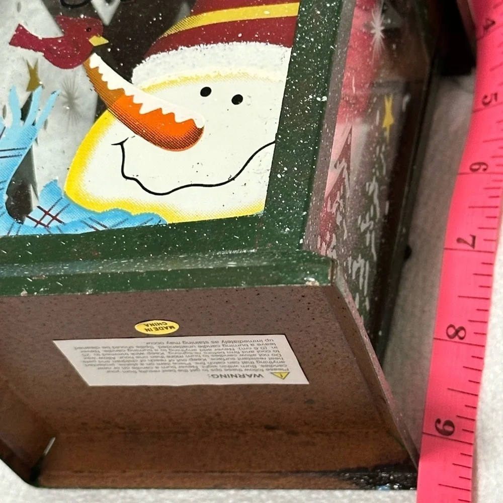 New! Metal Let it Snow lantern. Holds a tea light candle.